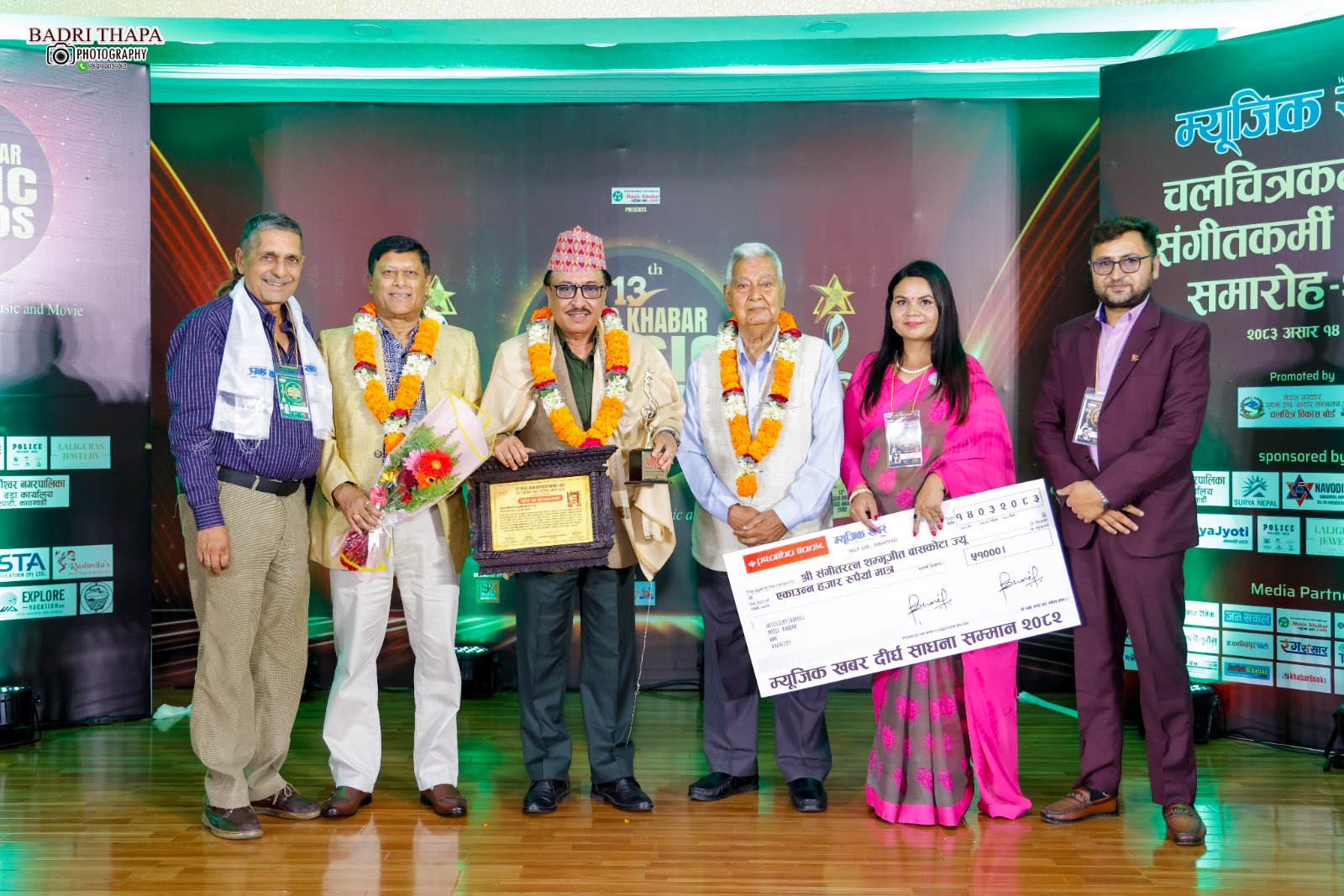Shambhujeet is honored with a Lifetime Achievement Award; Prabin and Sarika are named Best Male and Female Singers at the 13th Music Khabar Music Awards.